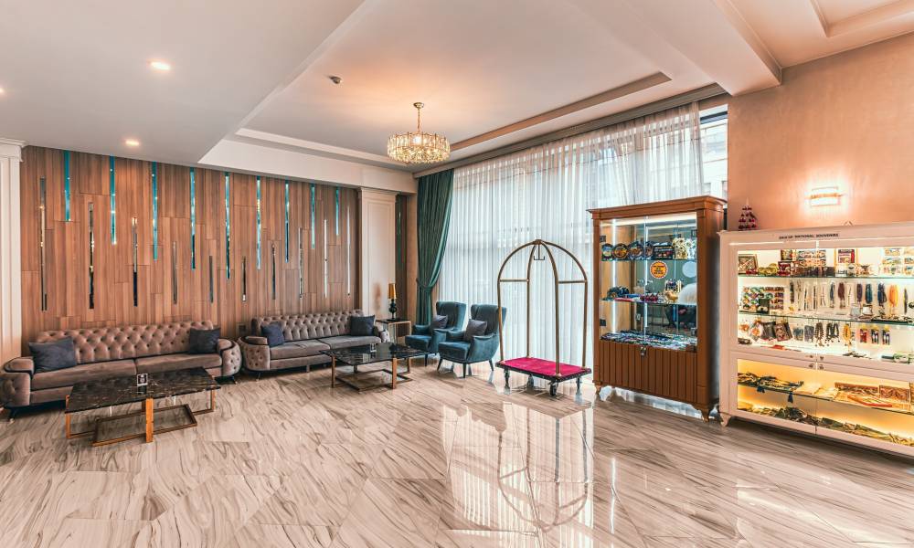 Experience timeless elegance in the grand lobby of Alba Hotel Spa. Relax, unwind, and begin your luxurious escape.